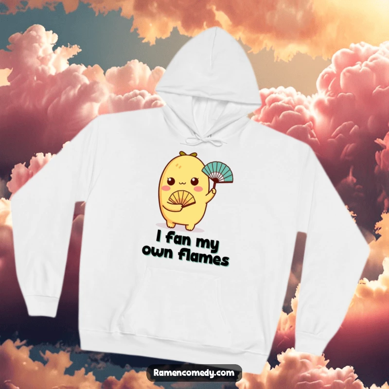 Funny tamagoyaki character holding a small fan on a soft hoodie, combining warmth and cuteness.