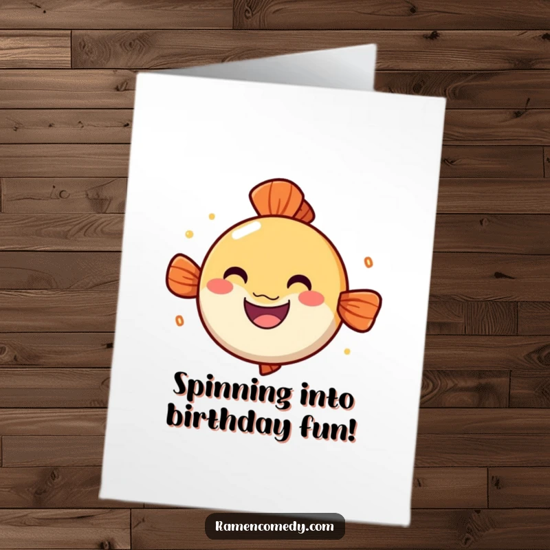 Funny free printable birthday card with a bouncy narutomaki fish cake with a cheerful grin spinning joyfully, celebrating your day.
