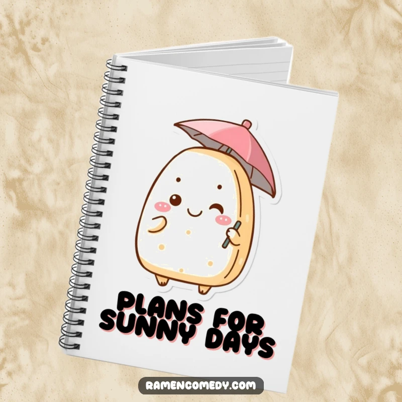 Funny onigiri notebook with a grinning rice ball character holding a small umbrella, ideal for journaling or note-taking.