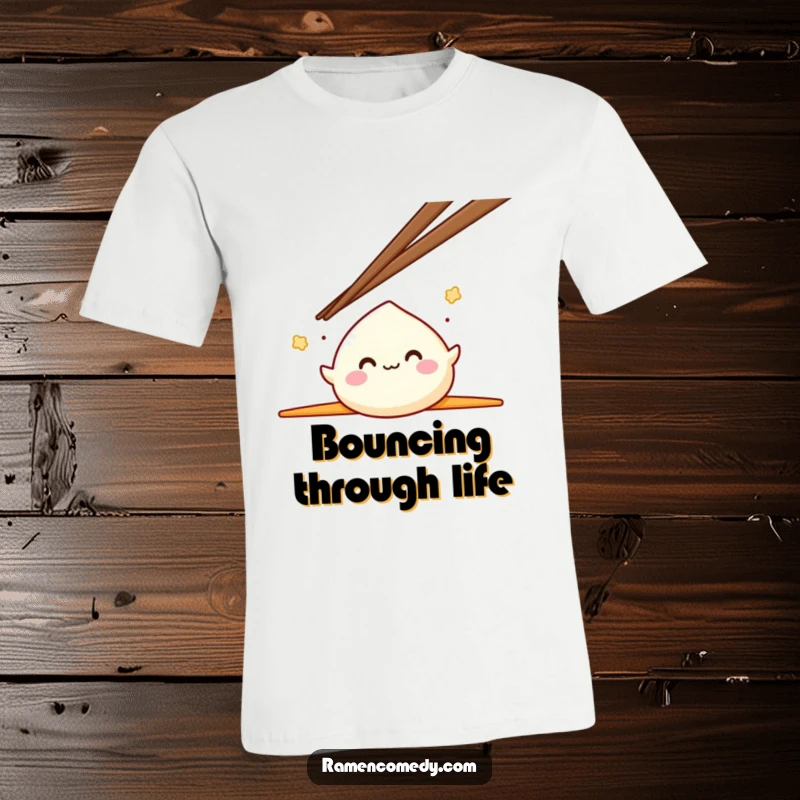 Funny Mochi T-Shirt showcasing a smiling mochi character energetically bouncing between two oversized chopsticks, a delightful scene.