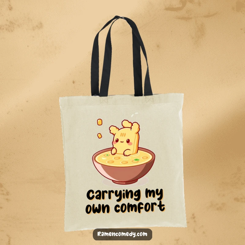 Funny Tote Bag displaying a piece of tempura happily floating in broth, perfect for carrying items with a touch of culinary zen.